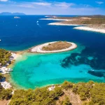 Pakleni otoci Marinkovac island turquoise bay yachting destination aerial view, Hvar island